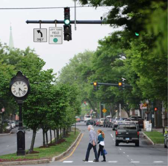 main street danbury couple crossing street