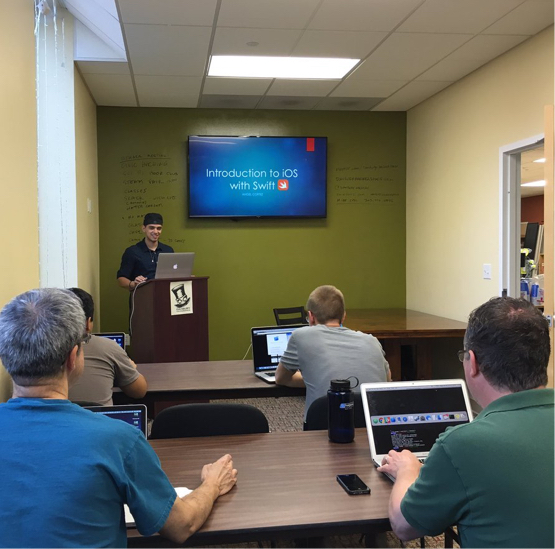 classroom of people on computers